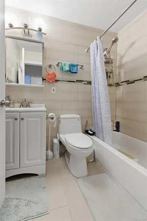 a bathroom with a sink toilet and a mirror