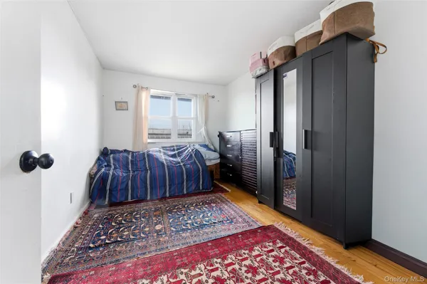 a bedroom with two beds and painted walls