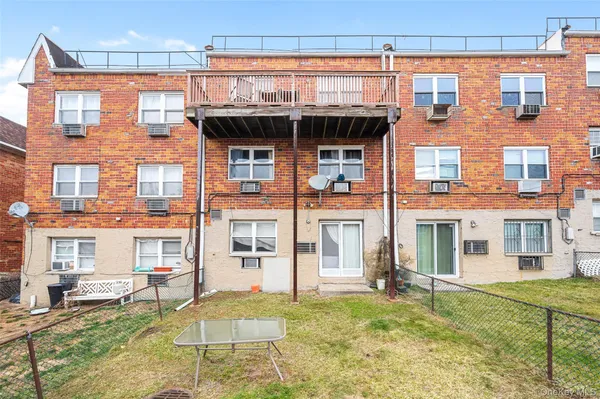 front view of a building with a yard