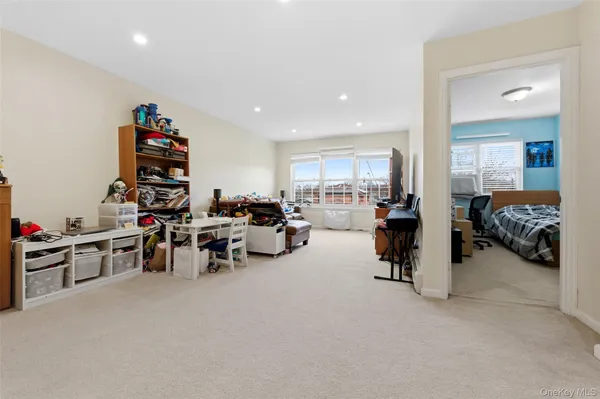 a view of a livingroom with furniture and a garage