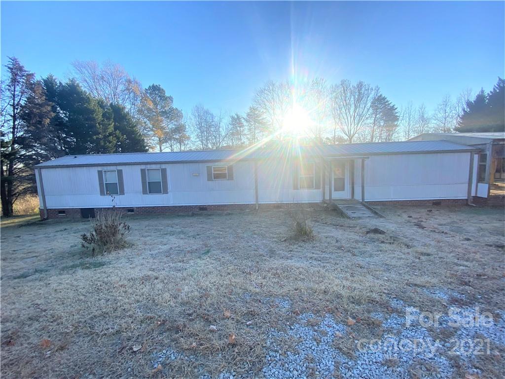 565 Burgray Road Woodleaf, NC 27054 - Photo 1 of 25 a view of back yard of the house