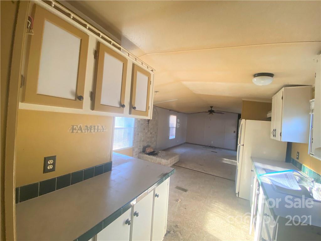 565 Burgray Road Woodleaf, NC 27054 - Photo 14 of 25 a view of a kitchen with a sink