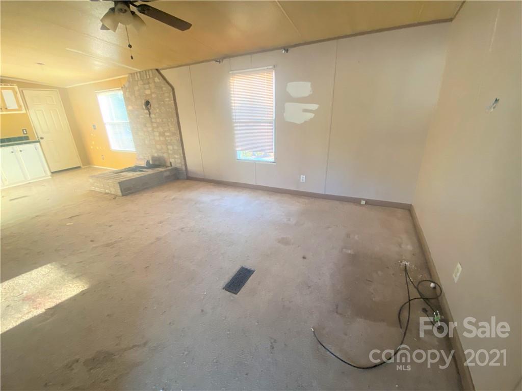 565 Burgray Road Woodleaf, NC 27054 - Photo 3 of 25 a view of a room with windows