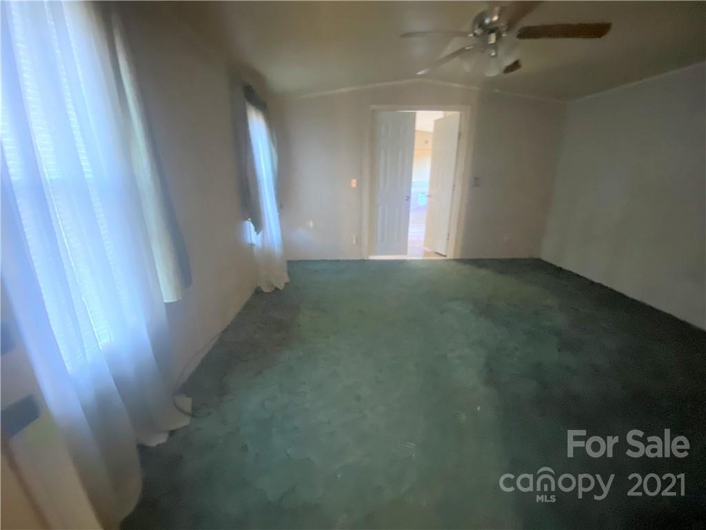 565 Burgray Road Woodleaf, NC 27054 - Photo 7 of 25 en empty room with windows