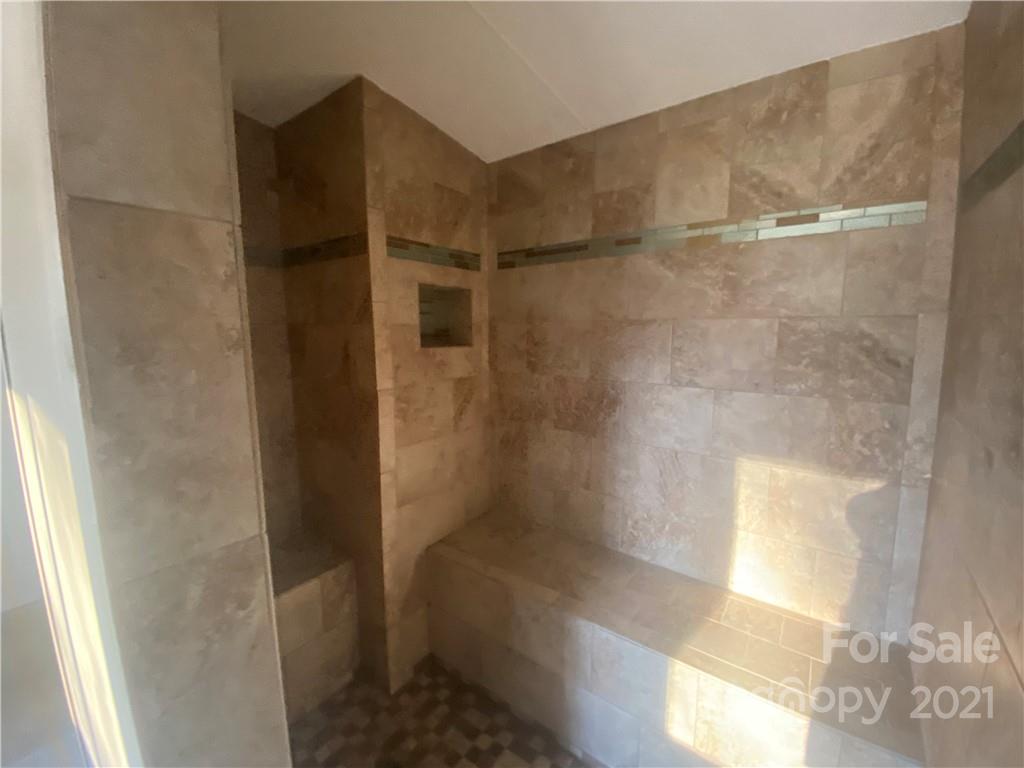 565 Burgray Road Woodleaf, NC 27054 - Photo 9 of 25 a bathroom with a shower