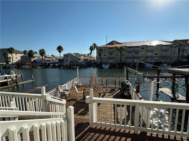 a view of a roof deck with two chair and a potted plant