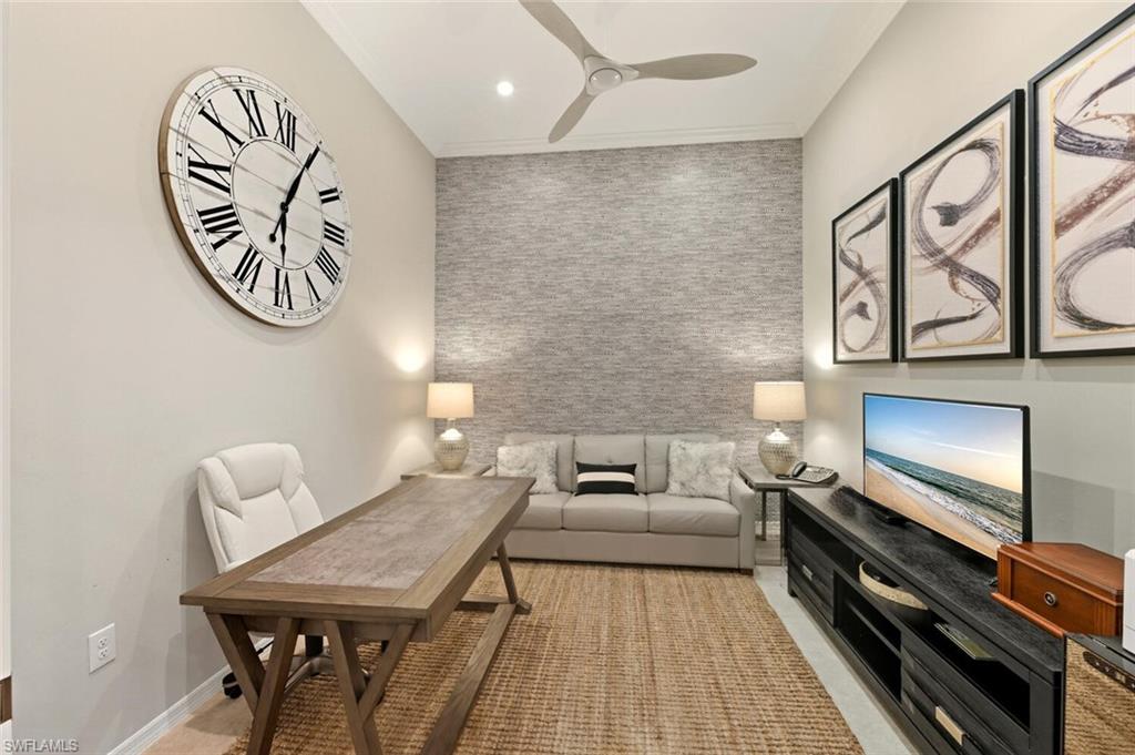 9365 Pocida Court, Unit 202 Naples, FL 34119 - Photo 8 of 40 a living room with furniture and a wooden floor