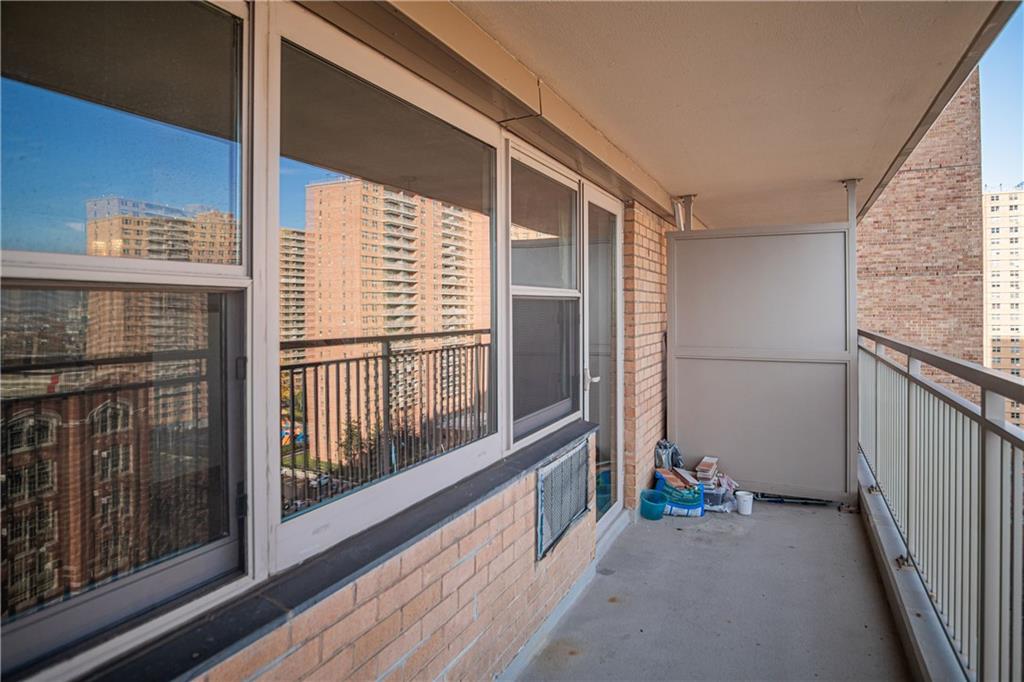 2915-2935 West 5th Street, Unit 13H Brooklyn, NY 11224 - Photo 12 of 16 a view of a balcony with wooden floor