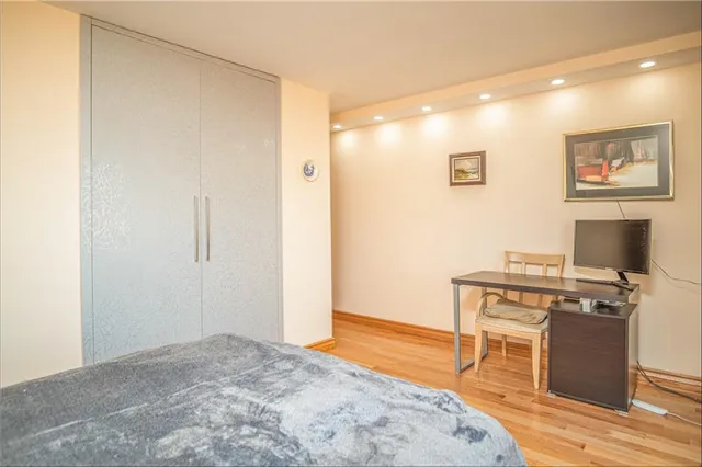 a kitchen with stainless steel appliances granite countertop a stove and a refrigerator