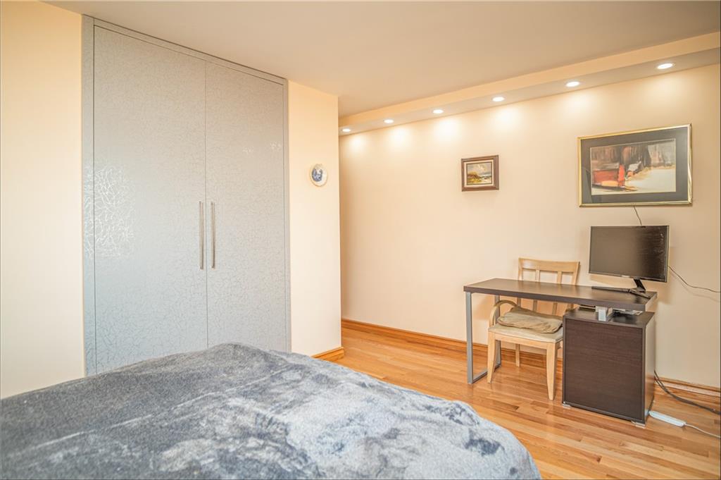 2915-2935 West 5th Street, Unit 13H Brooklyn, NY 11224 - Photo 3 of 16 a kitchen with stainless steel appliances granite countertop a stove and a refrigerator