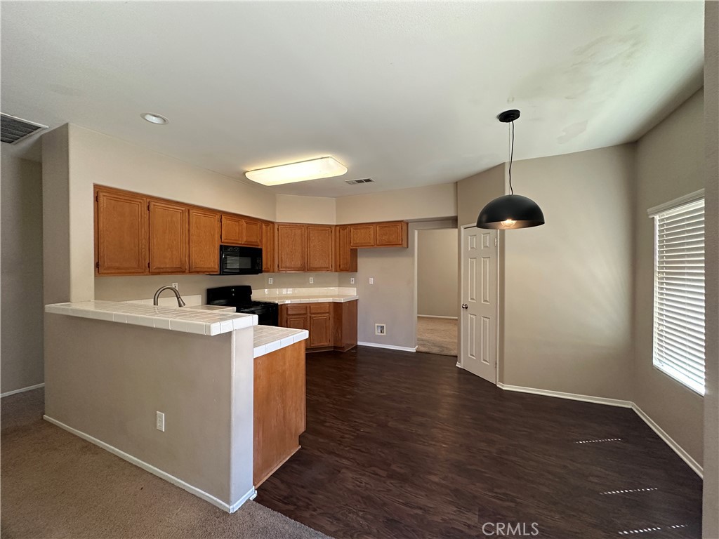 5231 Inglestone Drive Hemet, CA 92545 - Photo 26 of 75 a view of kitchen with sink and wooden floor