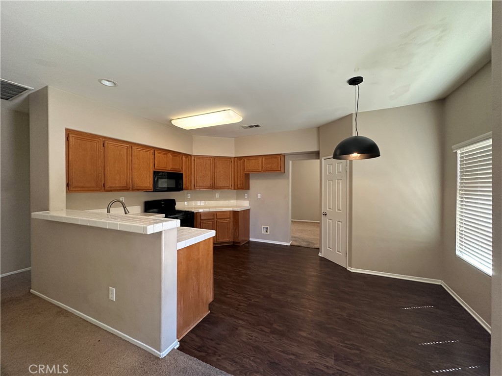 5231 Inglestone Drive Hemet, CA 92545 - Photo 27 of 75 a view of kitchen with sink and wooden floor