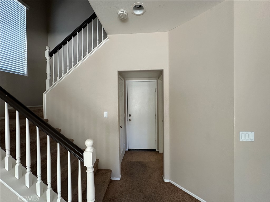 5231 Inglestone Drive Hemet, CA 92545 - Photo 35 of 75 a view of a hallway with staircase