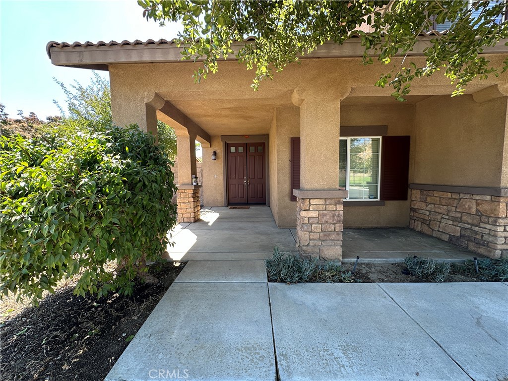 5231 Inglestone Drive Hemet, CA 92545 - Photo 4 of 75 a front view of a house with a yard