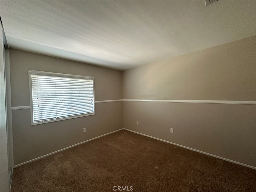 5231 Inglestone Drive Hemet, CA 92545 - Photo 46 of 75 an empty room with a window