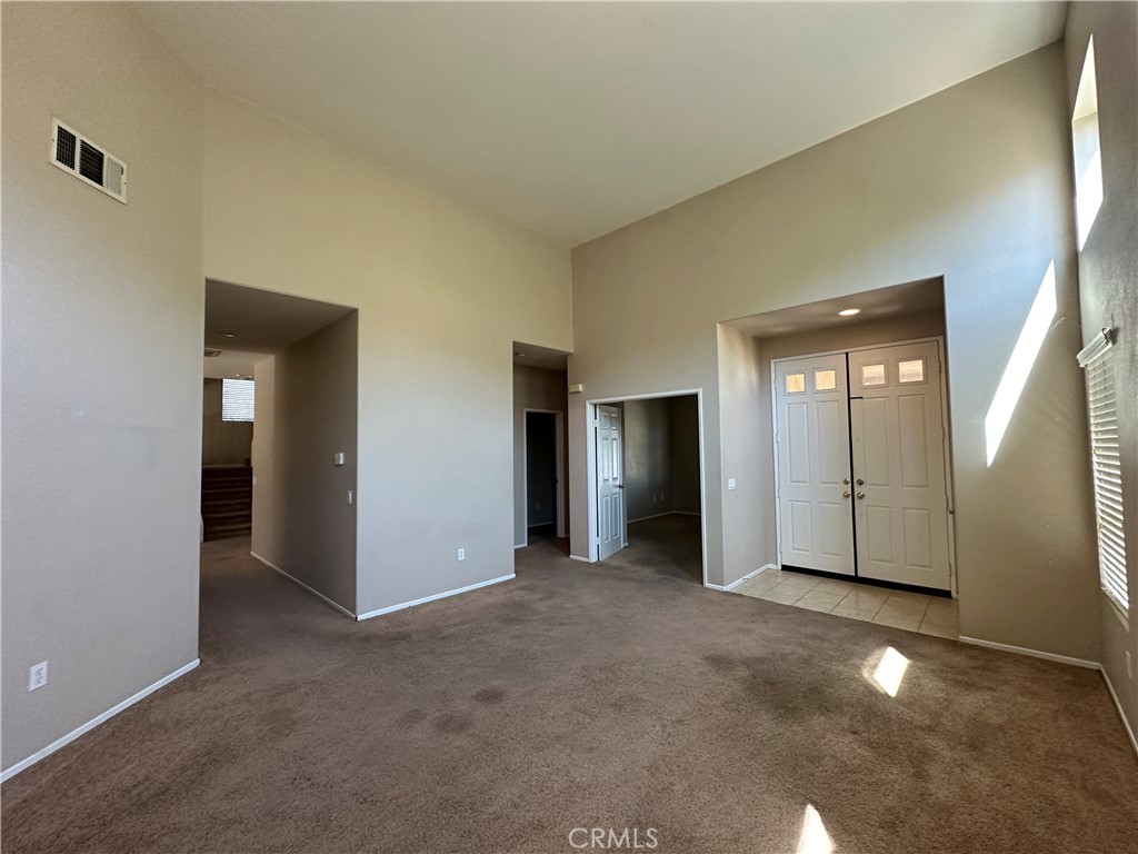 5231 Inglestone Drive Hemet, CA 92545 - Photo 7 of 75 an empty room with closet and mirror