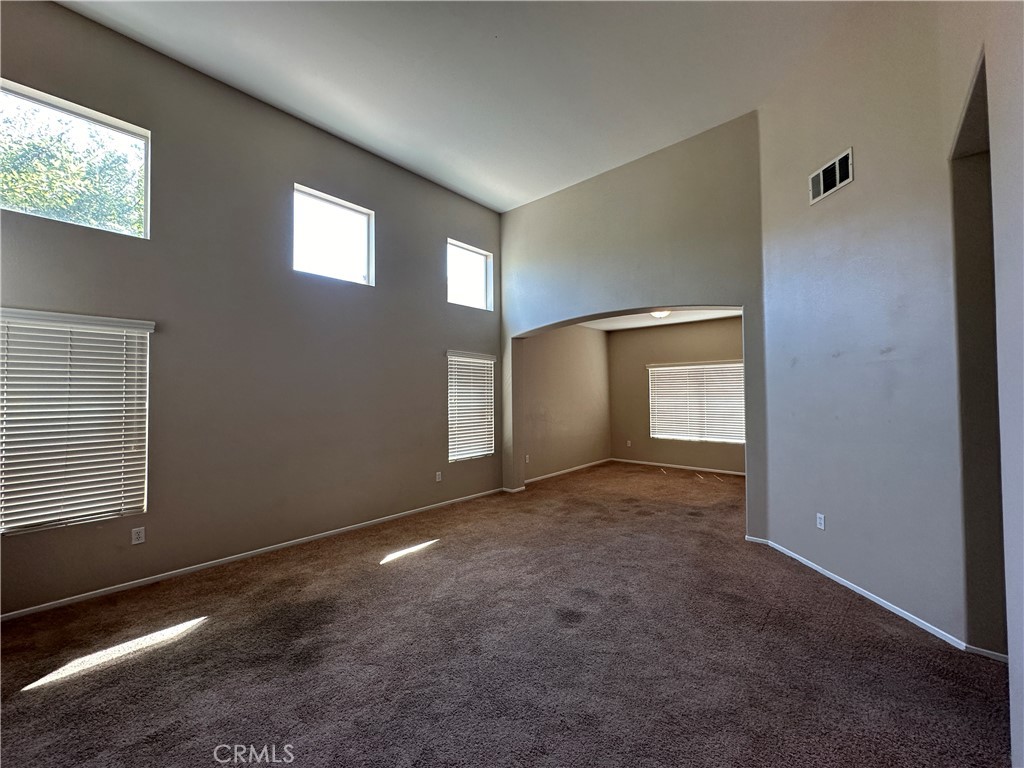 5231 Inglestone Drive Hemet, CA 92545 - Photo 9 of 75 a view of a livingroom with an empty space and a window