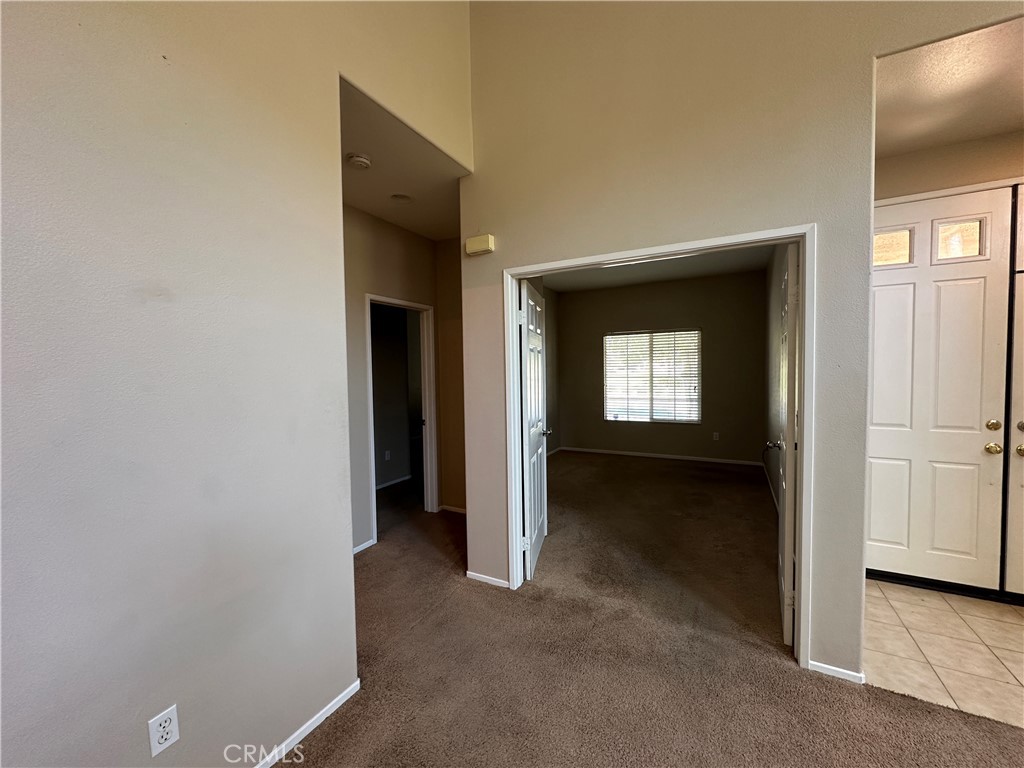 5231 Inglestone Drive Hemet, CA 92545 - Photo 10 of 75 a view of a hallway with wooden shelves
