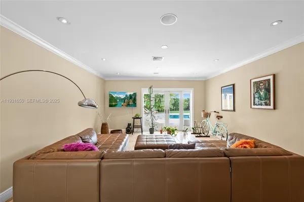 a living room with furniture and a window