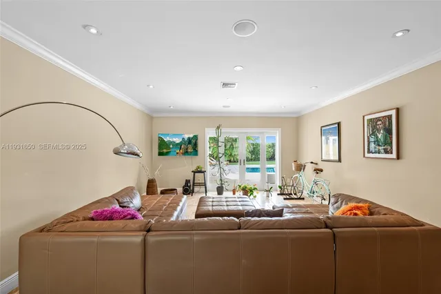 a living room with furniture and a window