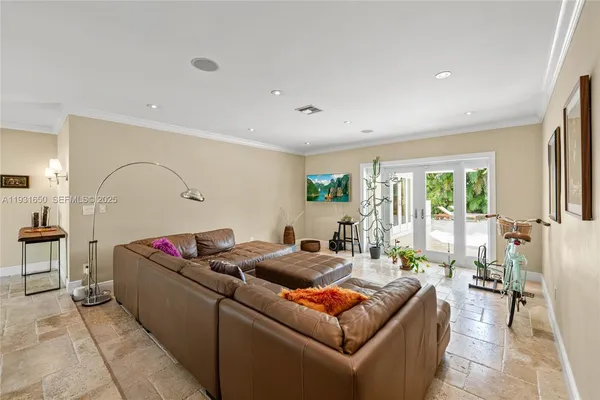a living room with furniture window and wooden floor