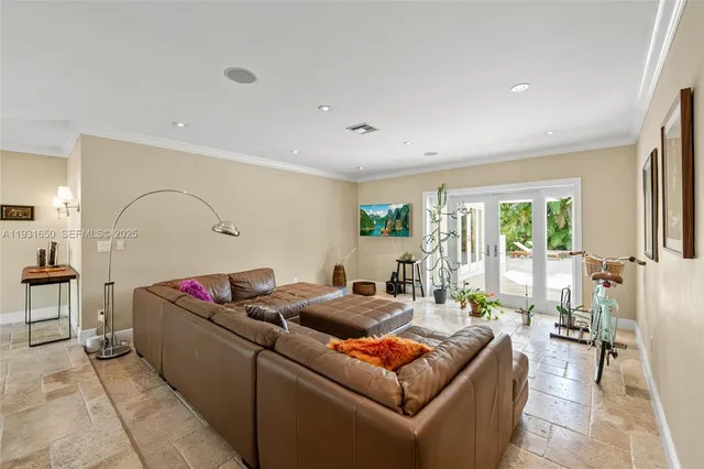 a living room with furniture window and wooden floor