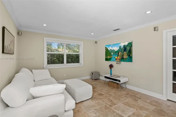 a living room with furniture and a window