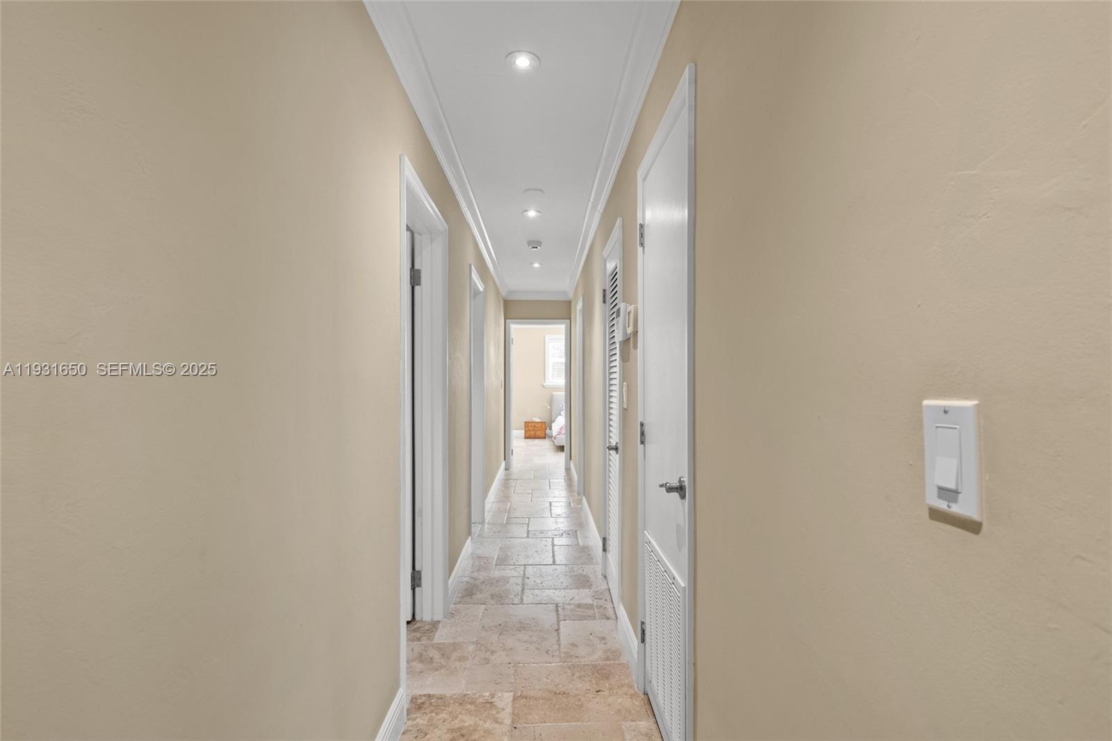7360 Southwest 115th Street Pinecrest, FL 33156 - Photo 28 of 49 a view of a hallway with wooden shelves