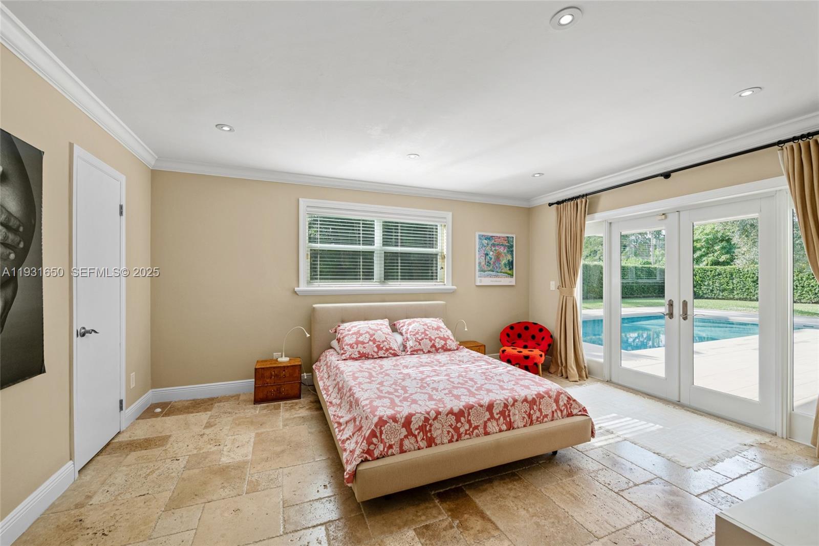 7360 Southwest 115th Street Pinecrest, FL 33156 - Photo 29 of 49 a bedroom with a bed and a window