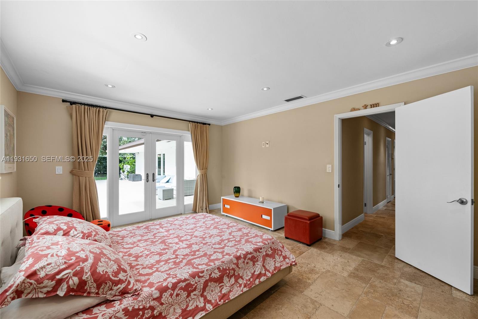 7360 Southwest 115th Street Pinecrest, FL 33156 - Photo 30 of 49 a bedroom with a bed and a window