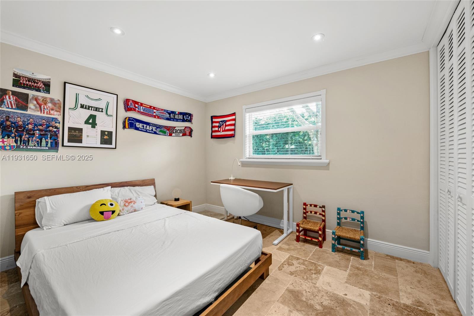 7360 Southwest 115th Street Pinecrest, FL 33156 - Photo 34 of 49 a bedroom with a bed and a window