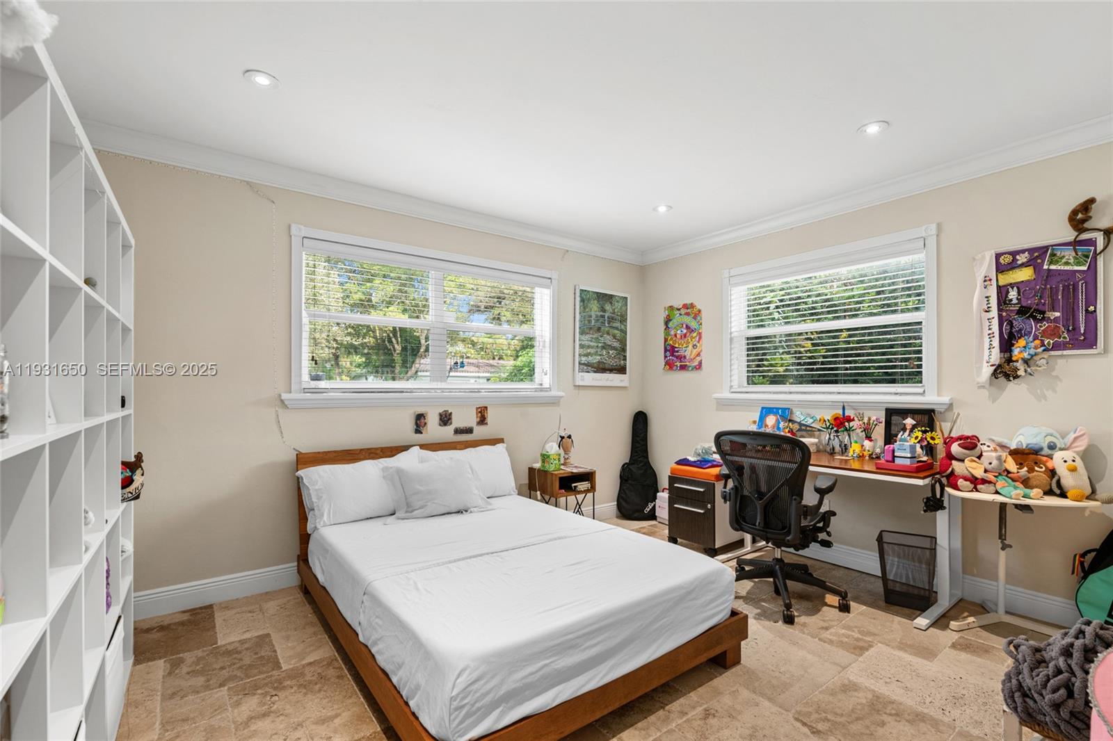 7360 Southwest 115th Street Pinecrest, FL 33156 - Photo 35 of 49 a bedroom with a bed a table and a window