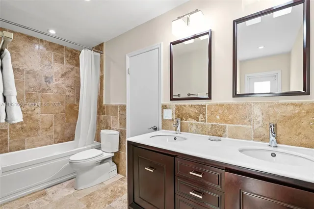 a view of storage and utility room with washer and dryer