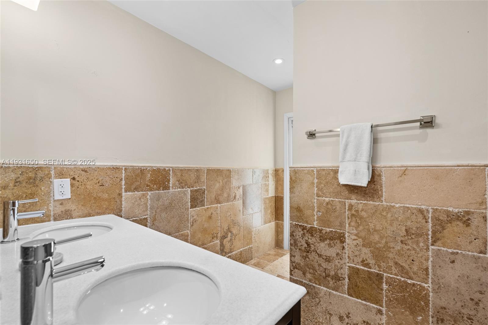 7360 Southwest 115th Street Pinecrest, FL 33156 - Photo 37 of 49 a bathroom with a sink and a shower