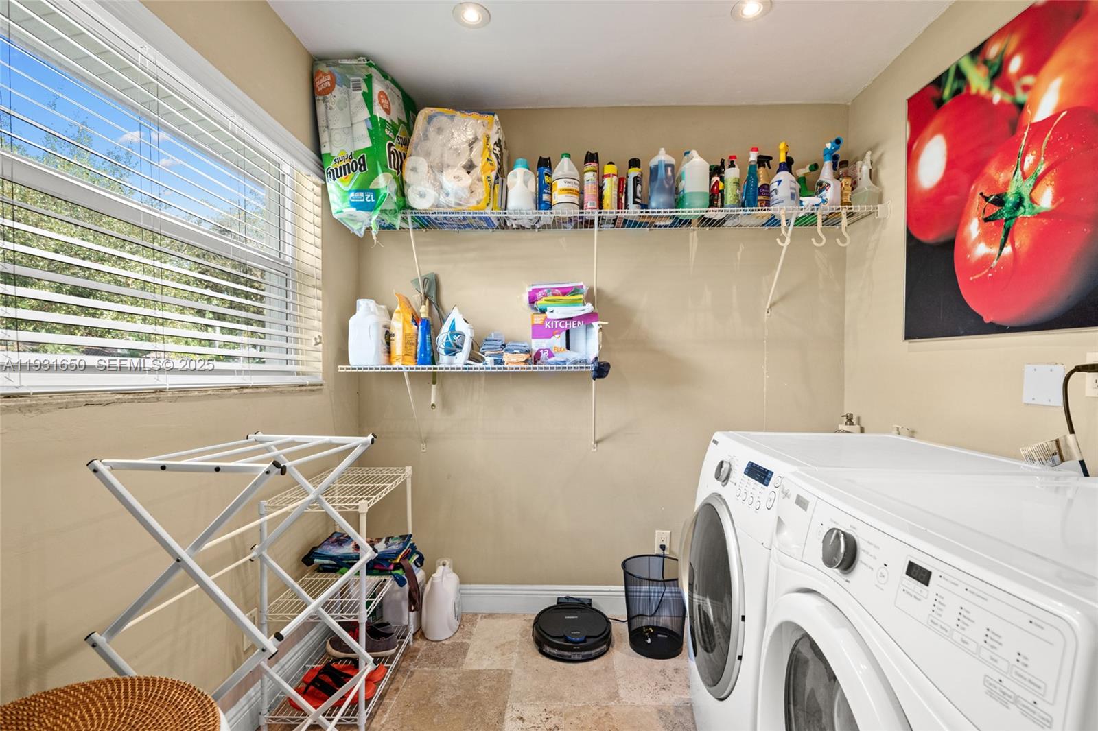 7360 Southwest 115th Street Pinecrest, FL 33156 - Photo 38 of 49 a view of storage and utility room with washer and dryer