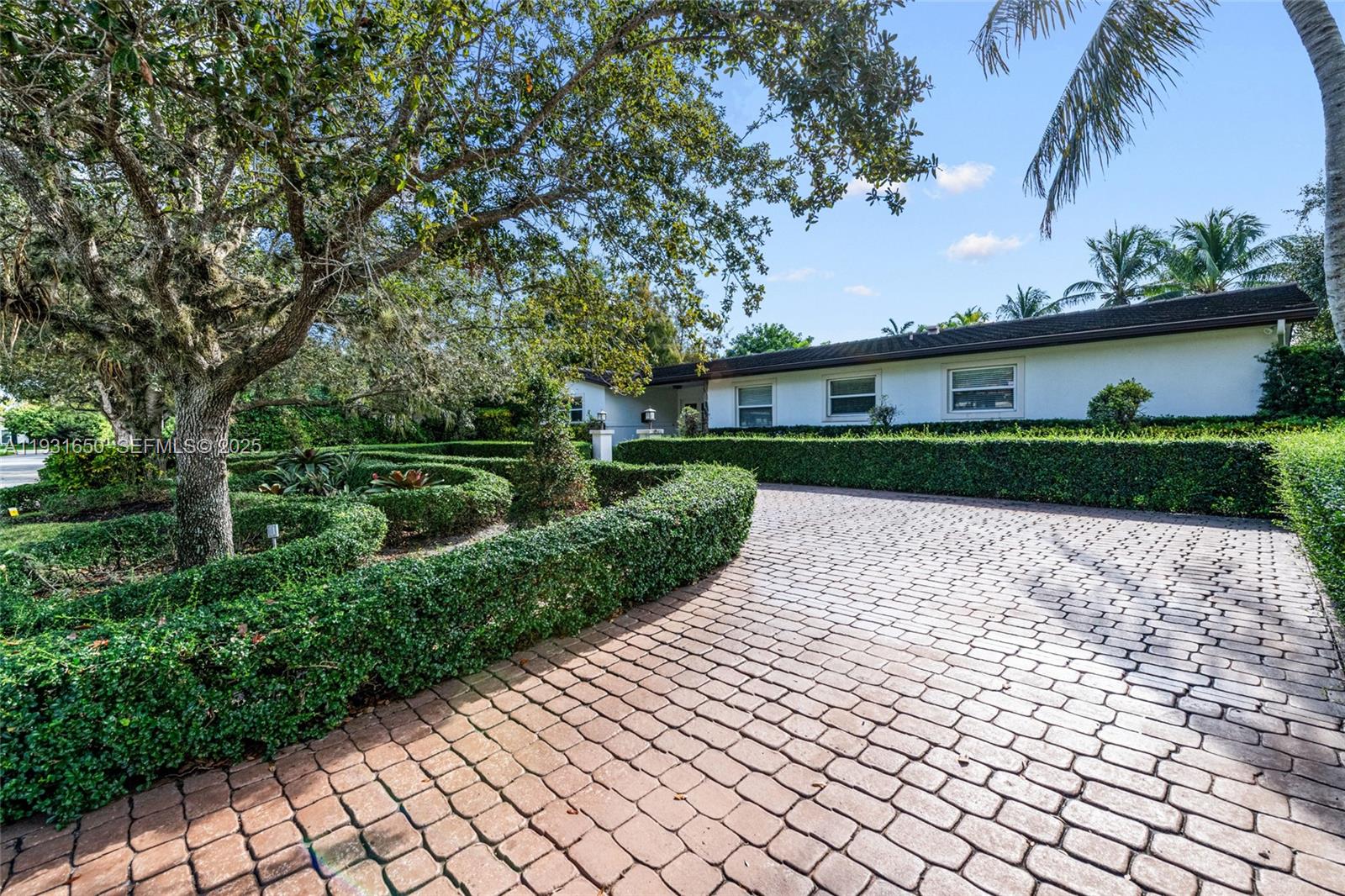7360 Southwest 115th Street Pinecrest, FL 33156 - Photo 5 of 49 front view of a house with a yard