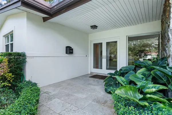 a house with a plant in front of it