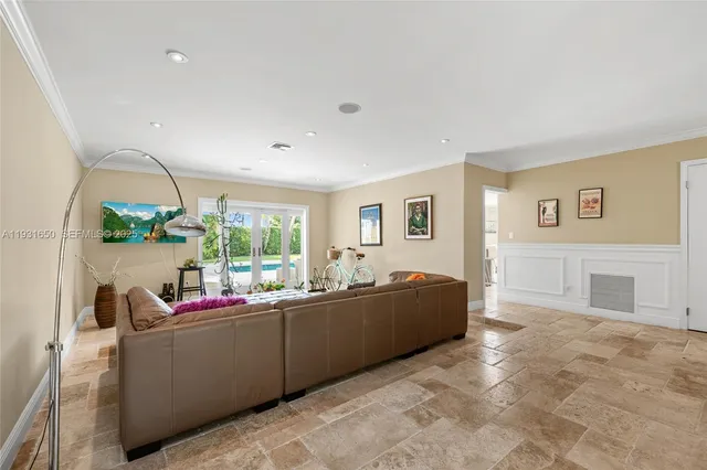 a living room with furniture window and a table