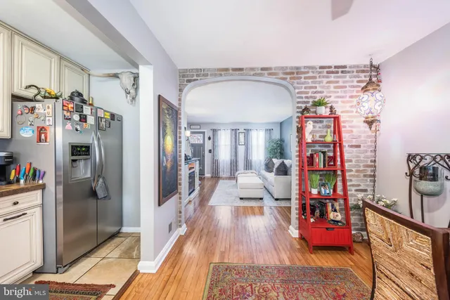 a hallway with beautiful frames and flower on it