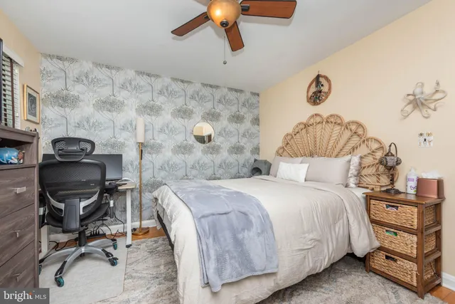 a bedroom with a bed and a chair