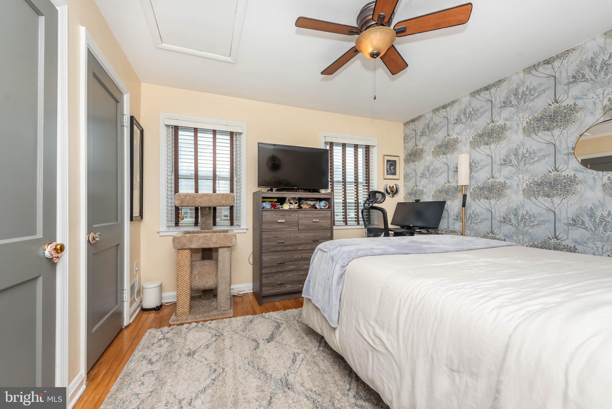 416 Imla Street Baltimore, MD 21224 - Photo 14 of 42 a spacious bedroom with a bed and a flat tv screen