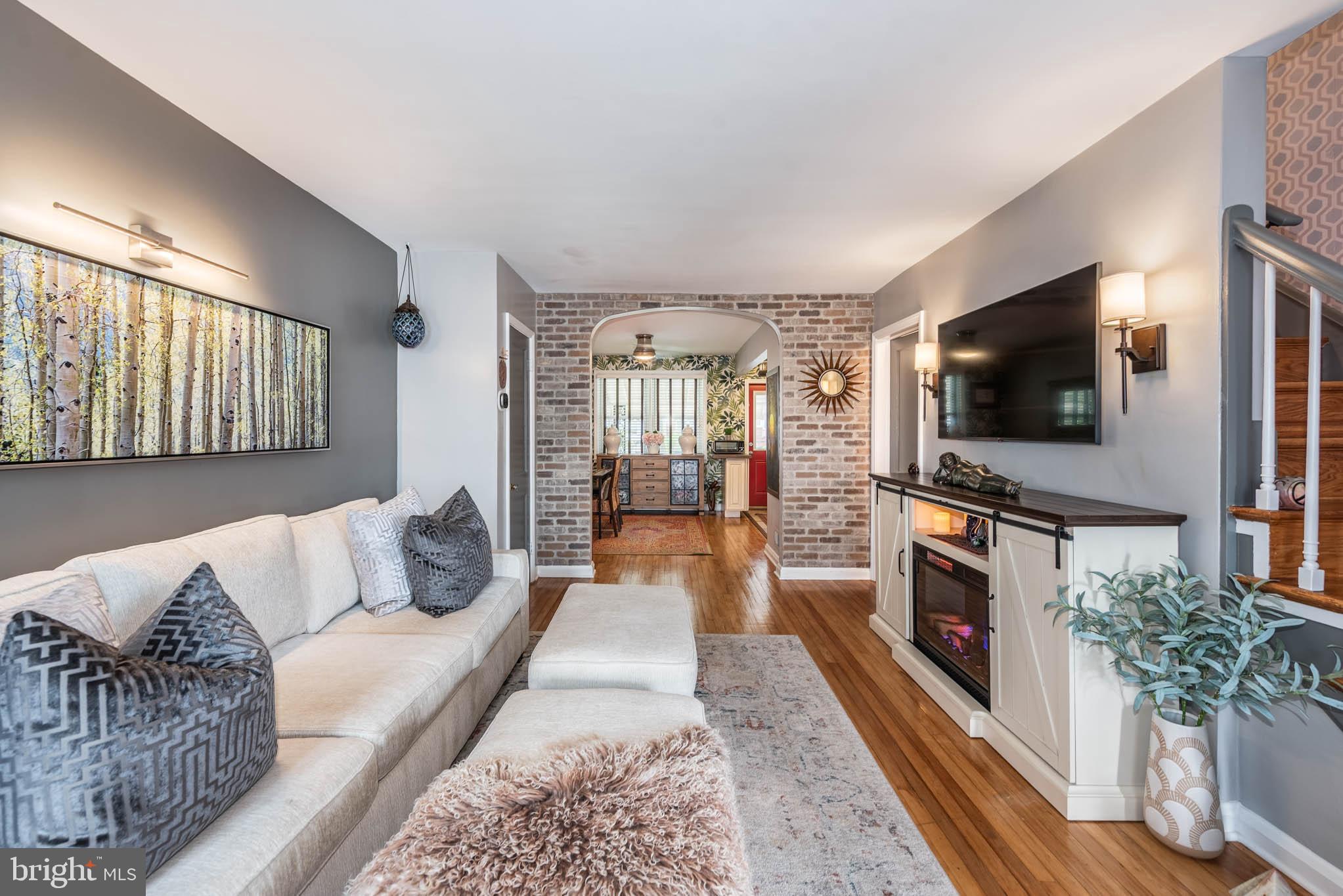 416 Imla Street Baltimore, MD 21224 - Photo 2 of 42 a living room with furniture and a flat screen tv