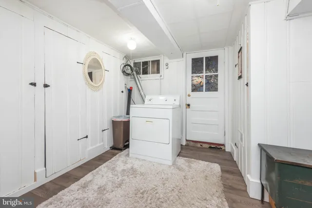 a view of a storage & utility room with a sink