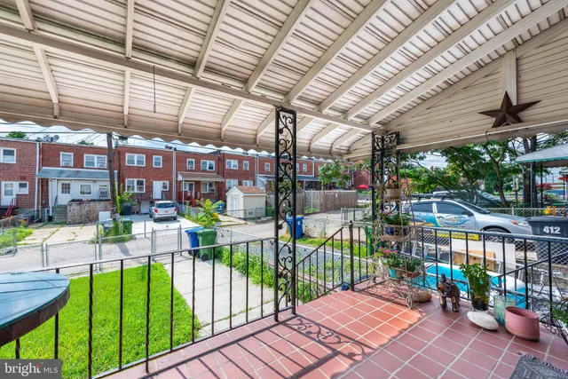 a view of a backyard with sitting area