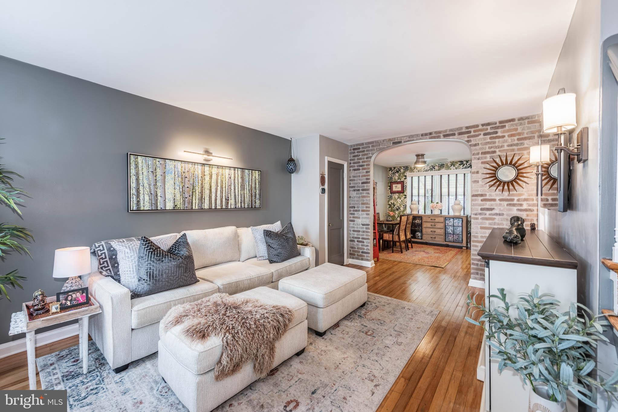 416 Imla Street Baltimore, MD 21224 - Photo 3 of 42 a living room with furniture and a wooden floor
