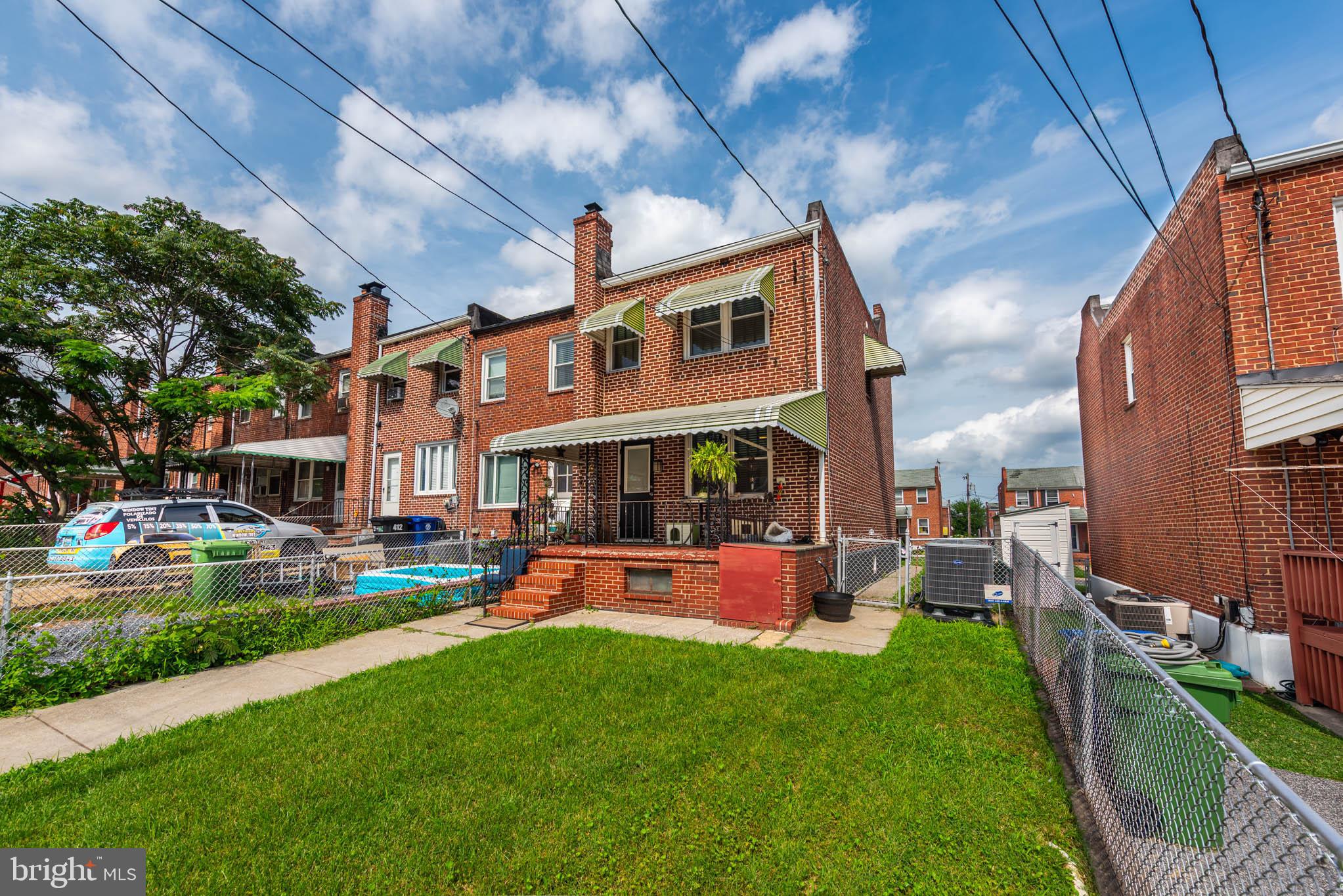 416 Imla Street Baltimore, MD 21224 - Photo 32 of 42 a front view of a house with swimming pool garden and patio