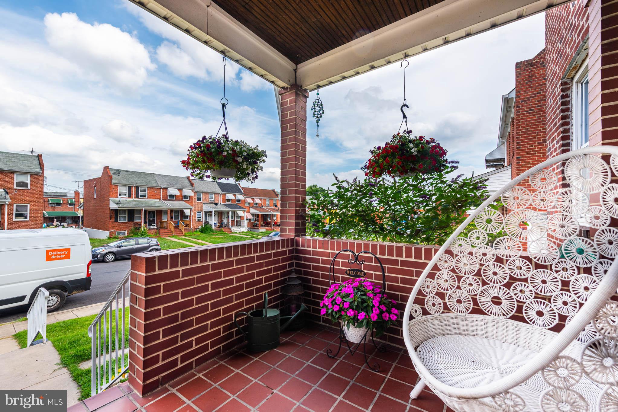 416 Imla Street Baltimore, MD 21224 - Photo 33 of 42 a view of a chairs and table in the back yard of the house