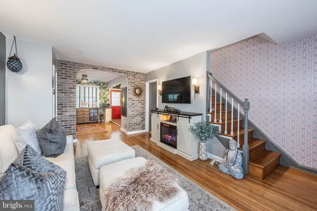 a living room with furniture and a flat screen tv
