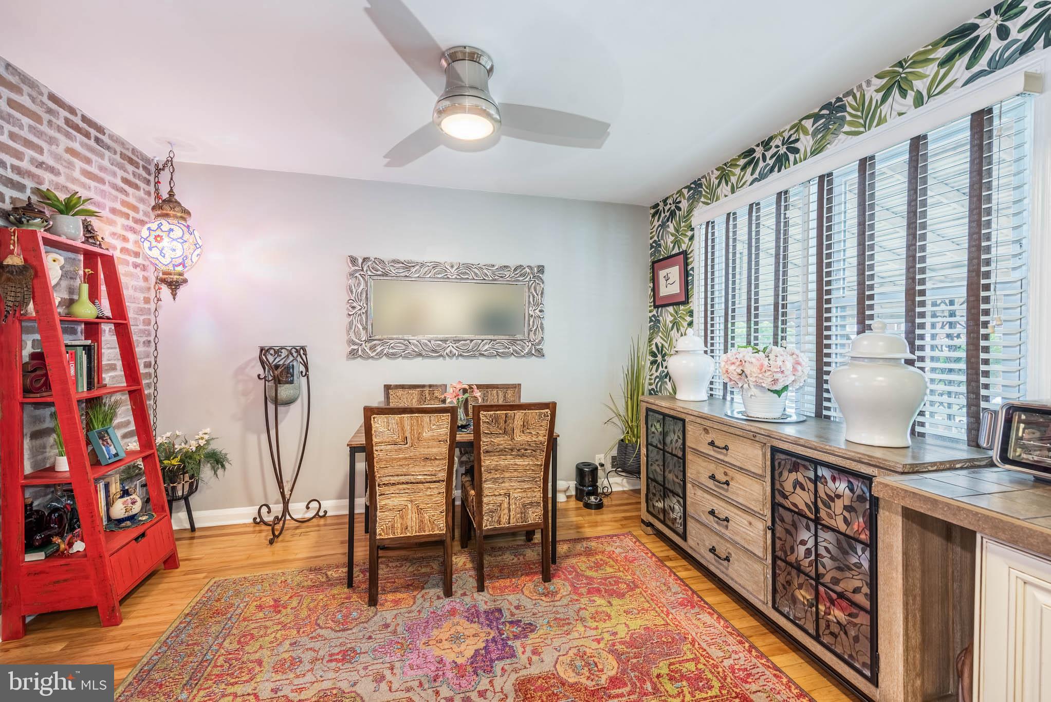 416 Imla Street Baltimore, MD 21224 - Photo 9 of 42 a bedroom with furniture and a wooden floor