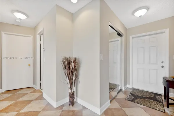 a view of a hallway with floor to a room